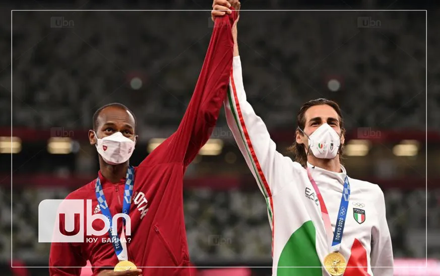 legacy:Olimpic games/ontsloh photo/Mutaz Essa Barshim of Qatar and Gianmarco Tamberi of Italy agree to share gold instead of going into a jump-off during the men's high jump copy.jpg